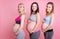 Three young moms smiling in the camera