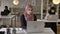 Three young muslim womans in hijab sitting and working in modern office, muslim female worker looking in camera and