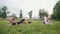 Three young sportsmen practice yoga in the park