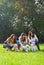 Three young woman with their pet dogs in the park