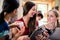 Three young women looking at pictures on tablet