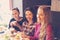 Three young women at a meeting in a cafe