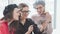 Three young women are smiling, making selfies. Woman friendship