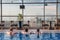 Three young women watching Dubai panorama from the hotel roof pool. Vacation in Dubai. Realxing in swimming pool