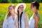 Three young women in white dress