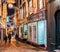 Three youngsters late night shopping in the city of Norwich