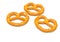 Three yummy salted pretzels on white