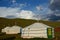 Three yurts in the steppe.