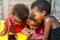 Threesome african kids having fun with tablet.