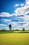 The Thrill of Lining Up a Putt with a Bright Sky Overlooking the Green Course Landscape