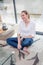 Thrilled beautiful girl with bare feet on living room floor