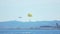 Thrilling parachute flight over sea, parasailing sport, tourists enjoying rest