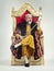 Throne of the kings. Studio shot of a richly garbed king sitting on a throne holding his scepter.