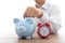 Throw a coin into the piggy bank and an alarm clock next to the piggy bank