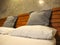 Throw Pillows and pillow on White bed