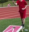 Throwing bean bag during corn hole game