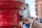 Throwing a letter in a red British post box