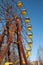 The thrown wheel a review against the blue sky in amusement park in Pripyat after the Chernobyl accident