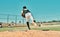 He throws nothing but fast pitches. Shot of a young baseball player pitching the ball during a game outdoors.