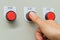 Thumb touch on red stop switch