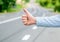 Thumb up gesture try stop car road background. Hand gesture hitchhiking. Make sure you know right gestures to stop car