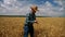 Thumb up happy farmer checking grain plantation