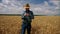 Thumb up happy farmer checking wheat plantation