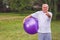 Thumb up for healthy exercising - Happy senior man with fitness