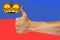 Thumbs up on a background of a flag of Liechtenstein