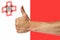 Thumbs up on a background of a flag of Malta