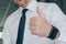 Thumbs up, businessman gesturing approval hand sign