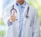 Thumbs up, doctor and hand of woman or medical worker on a blurred background. Healthcare expert finger, like or