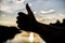 Thumbs up gesture sign of best choice approve and accept. Top places to visit in evening. Silhouette thumb up gesture in