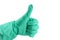 Thumbs up with a green vinyl glove on white background