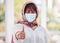 Thumbs up, Islamic woman and mask for covid protection, vaccine and health outdoor. Muslim female, hand gesture or