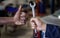 Thumbs up for maintenance. Closeup shot of one mechanic holding a spanner and another giving thumbs up in their workshop