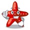 Thumbs up red starfish animal on mascot sand