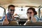 Thumbs up for roadtrips. Rearview portrait of an affectionate couple giving you a thumbs up while enjoying a road trip.