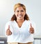 Thumbs up, thank you and motivation with a business woman and winner in her office with a smile. Hands, happy and