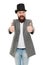 Thumbs up to retro. Bearded man wearing cylinder hat in retro style. Caucasian guy showing thumbs ups in retro tophat