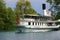 THUN, Switzerland, August 8, 2022: Tourists on the board of a touristic ship entering in Thun harbour, Switzerland