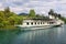THUN, Switzerland, August 8, 2022: Tourists on the board of a touristic ship entering in Thun harbour, Switzerland