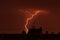 Thunder lightning over the city rooftops