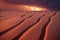 Thunder storm with lightening rages over rippled desert dune natural disaster background. Intense electricity bolts