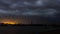 Thunderbolt in the dramatic dark sky over the city of time lapse