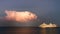 Thunderbolt from one stormy cloud next to a cruise ship docked at evening in Rhodes, Greece