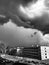 Thunderclouds over a city courtyard.