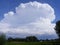 Thunderhead cloud over French field