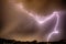 Thunderhead and Lightning Over City