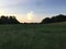 Thunderstorm building over a meadow.